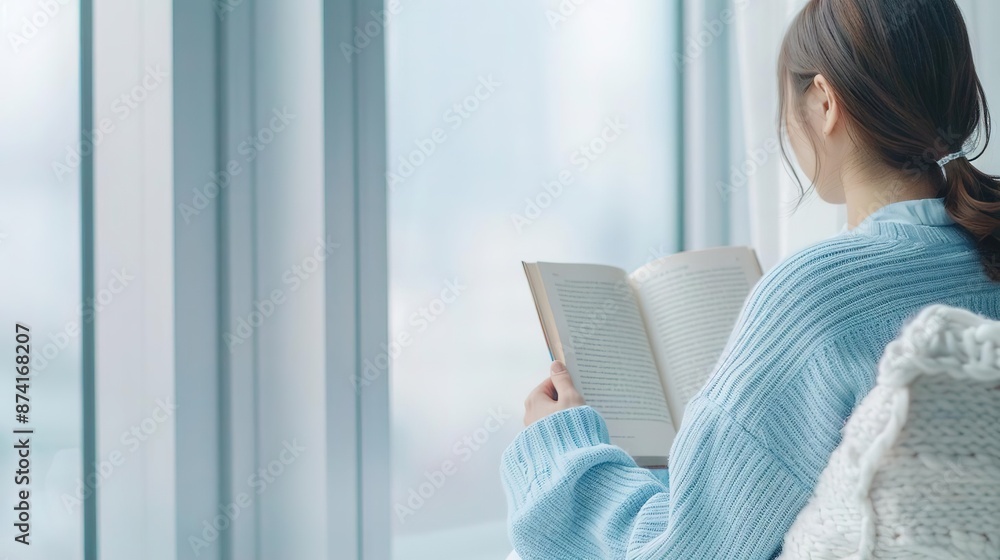 Man in white pajamas looking out window at ocean view. Man in white pajamas looking out window at ocean view.