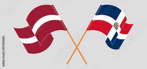 Crossed and waving flags of Latvia and Dominican Republic photo
