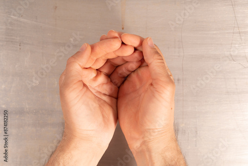 Two hands cupped together i...