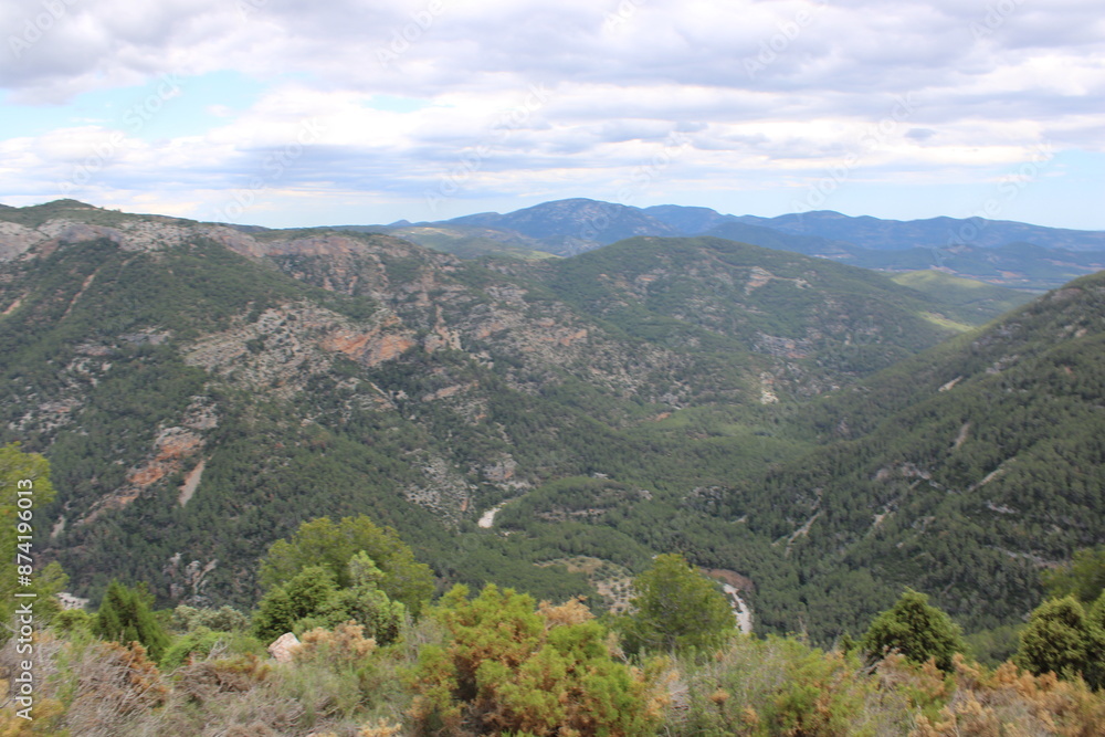 Mountains of El Maestrazgo, Castellón, Spain, rugged, rocky, colorful, and with trees Mountains of El Maestrazgo, Castellón, Spain, rugged, rocky, colorful, and with trees