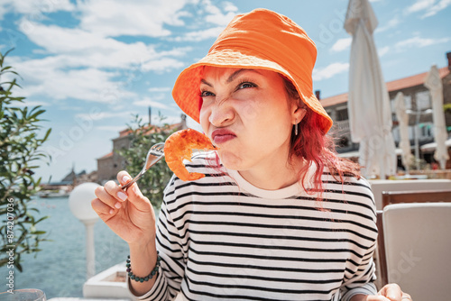 Tablou pe pânză Person experiencing health concerns after consuming spoiled prawns, wary of potential foodborne illnesses