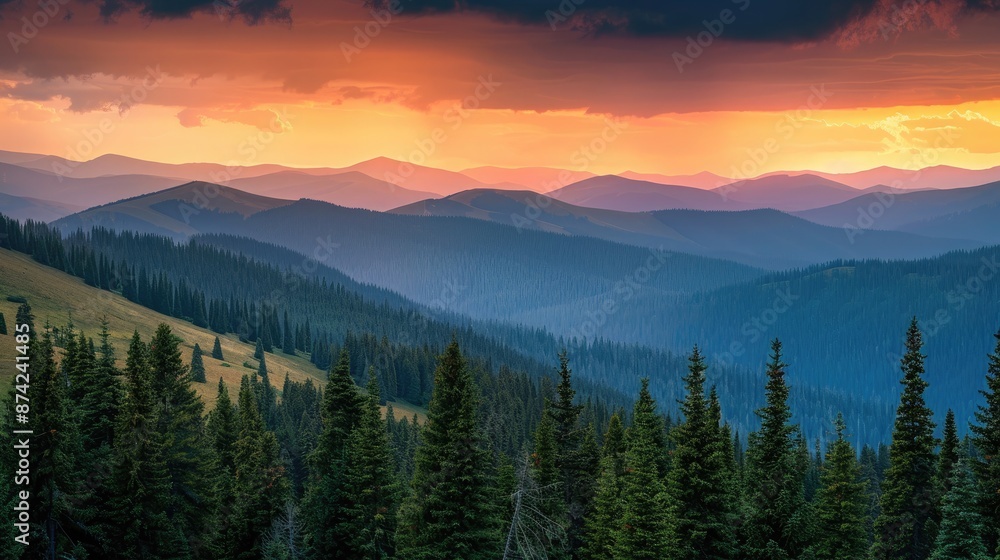 Obraz premium A peaceful mountain range with a series of rolling hills and dense pine forests, under a dramatic sunset.