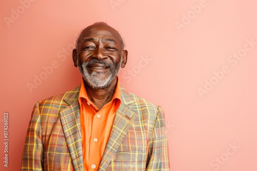 Portrait of a satisfied afro-american man in his 50s dressed in a stylish blazer over pastel or soft colors background © CogniLens
