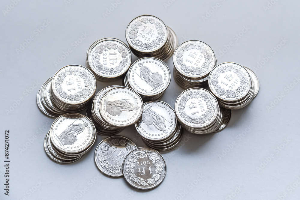 stack of coins spread on white background
