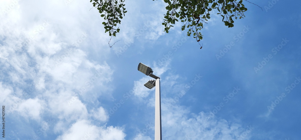 A modern street LED lighting pole. LED Street Light on blue sky, cloud background. electro-energy technologies. Outdoor LED Lighting. Solar panel street light - Eco-friendly
A modern street LED lighting pole. LED Street Light on blue sky, cloud background. electro-energy technologies. Outdoor LED Lighting. Solar panel street light - Eco-friendly