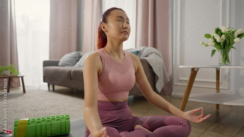 Home yoga practice and relaxing, Asian woman practicing alone in silence in room . Healthy lifestyle and care about body and mind conditions, meditation and relax after workout, keep fit and stay calm Home yoga practice and relaxing, Asian woman practicing alone in silence in room . Healthy lifestyle and care about body and mind conditions, meditation and relax after workout, keep fit and stay calm