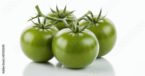 Wallpaper Mural Four green tomatoes, still attached to a vine, rest on a white surface Torontodigital.ca