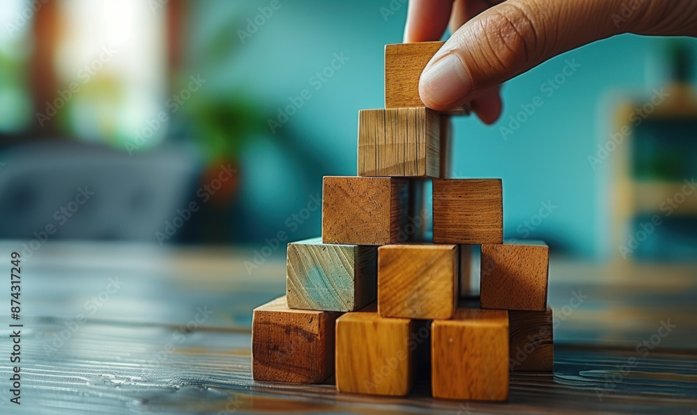 business development and growth success process concept, close up hand arranging wood block stacking, background with copy space
business development and growth success process concept, close up hand arranging wood block stacking, background with copy space