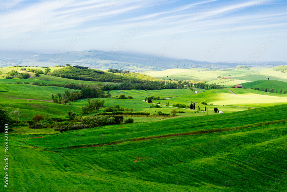 Fototapeta premium Tuscany, Italy-April 22, 2024: Rolling Green Hills of Tuscany in Spring