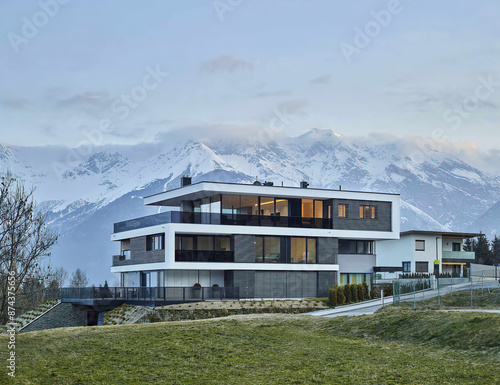 Facade of luxurious three-storey house in mountains