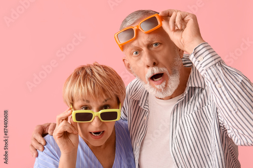 Shocked mature couple in su...