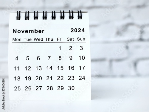 November 2024 white monthly desk calendar on a table
