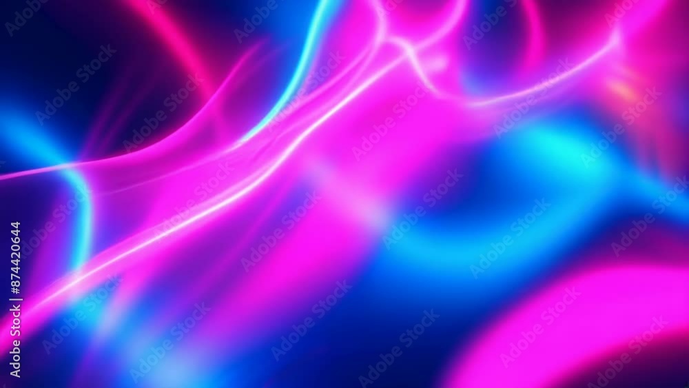 The image features vibrant pink and blue neon lights forming abstract streaks against a dark background. The light trails create a dynamic and energetic mood, suggesting a nighttime scene. The image features vibrant pink and blue neon lights forming abstract streaks against a dark background. The light trails create a dynamic and energetic mood, suggesting a nighttime scene.