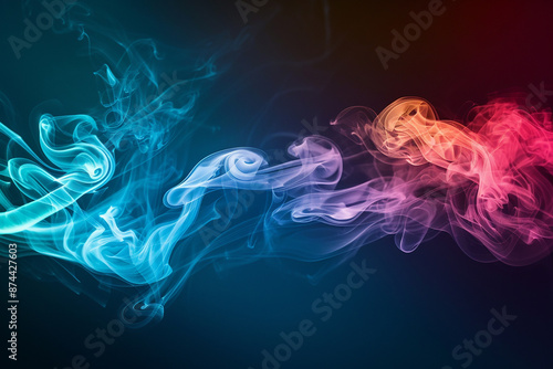 Colorful smoke in blue, purple, and orange hues swirling on a dark background, abstract concept of fluidity and motion.