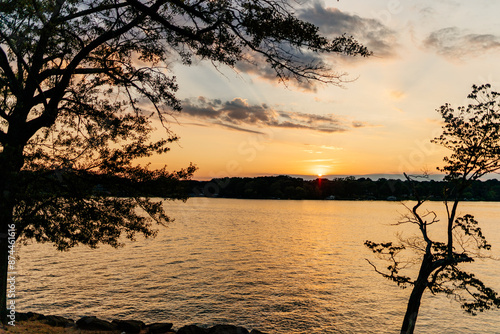 Beautiful sky and lake at sunset. Beautiful orange and blue sky at dawn. Lake Bowen Anchor Park, Inman, SC, USA  photo