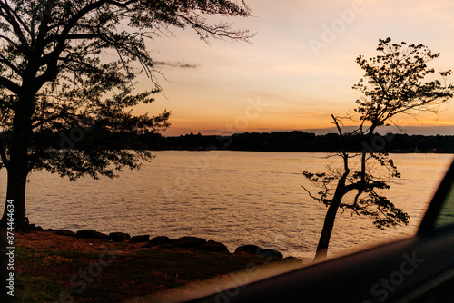 Beautiful sky and lake at sunset. Beautiful orange and blue sky at dawn. Lake Bowen Anchor Park, Inman, SC, USA  photo