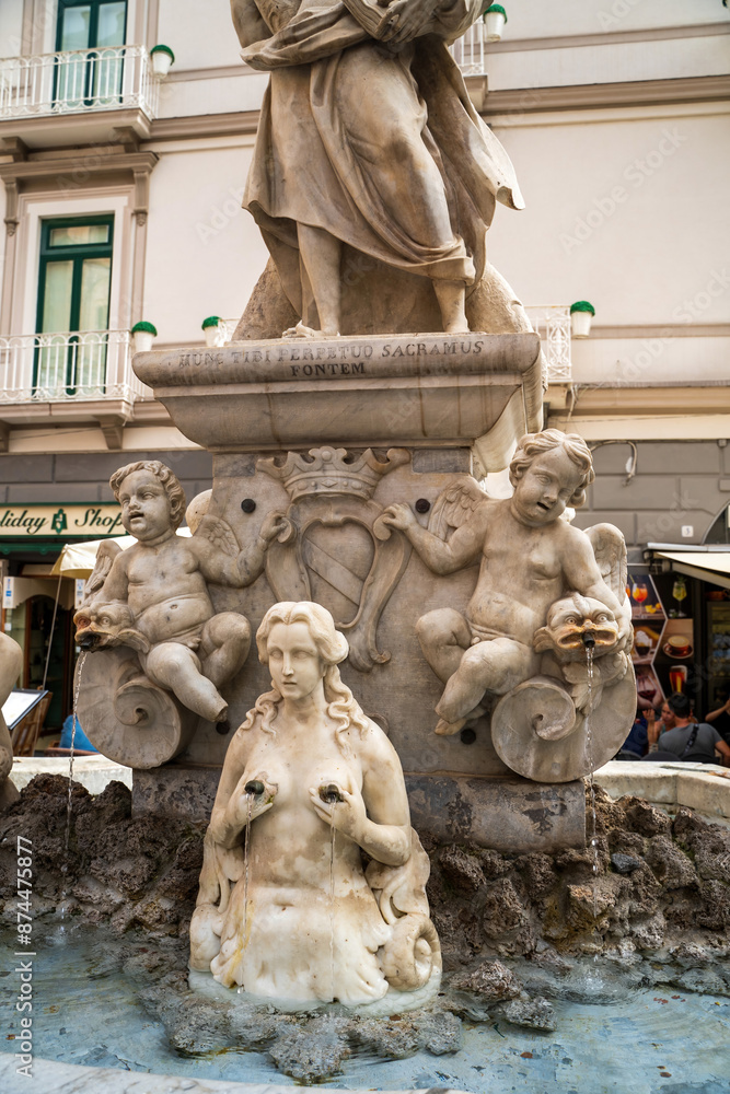 Amalfi, Italy - June 24, 2024: Fountain with the figure of Saint Andrew in the Cathedral Square of Amalfi.