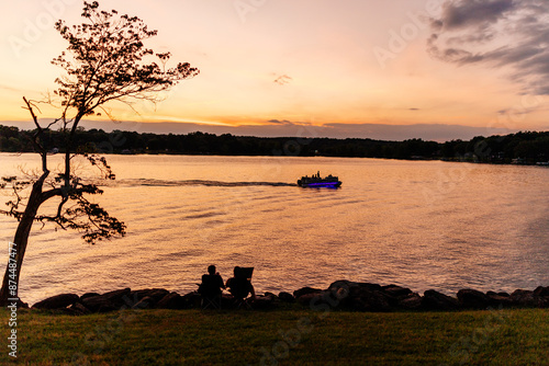 Beautiful sky and lake at sunset. Beautiful orange and blue sky at dawn. Lake Bowen Anchor Park, Inman, SC, USA  photo