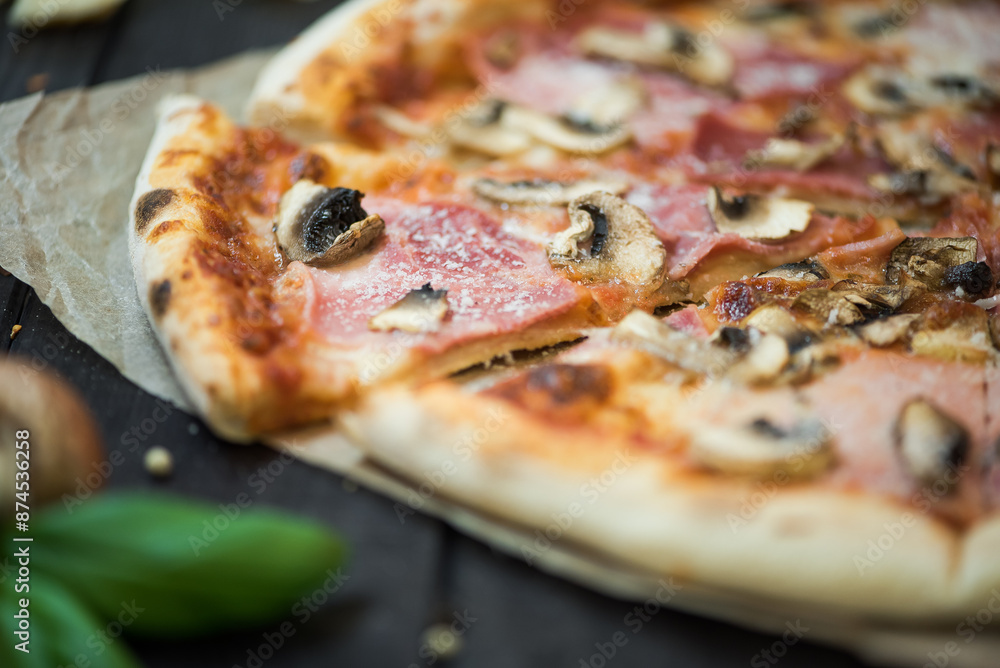 Delicious pizza with cheese, ham and mushrooms. Pizza with a thick side, Italian style. Delicious pizza with cheese, ham and mushrooms. Pizza with a thick side, Italian style.