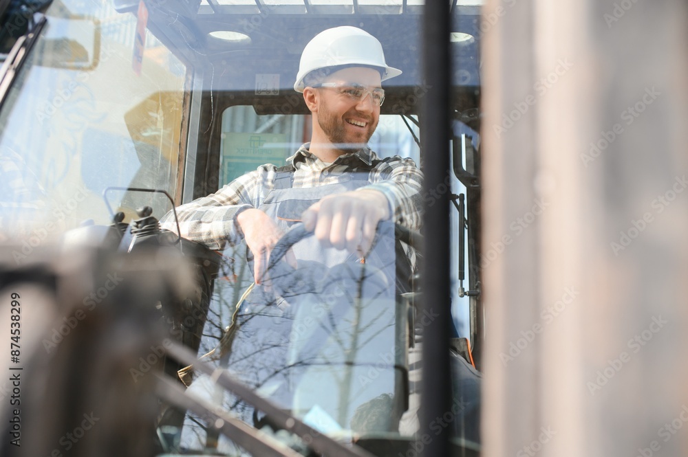 Man worker at forklift driver happy working in industry factory logistic ship