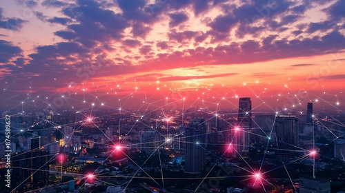 Smart city network with glowing nodes over cityscape at sunset.