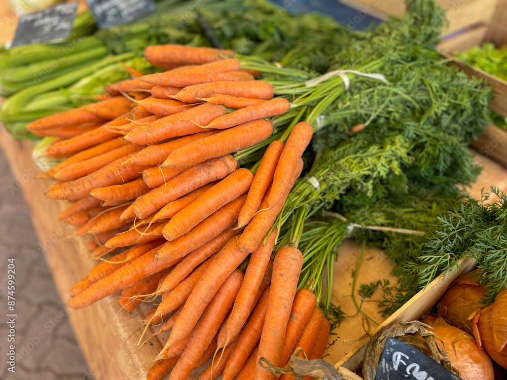 Fresh carrots on a farmers market close up