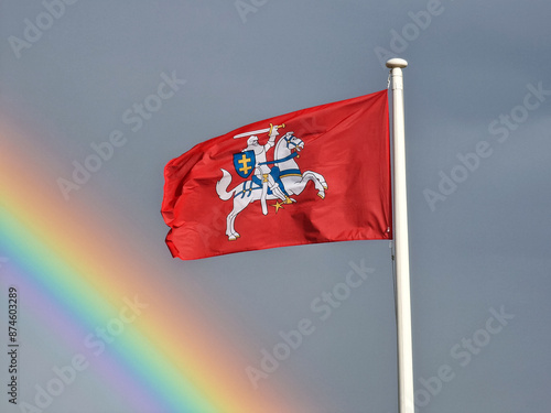 Lithuanian flag with real rainbow background photo