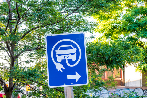 Photography green infrastructure: ev charging station signage with a directional arrow shot