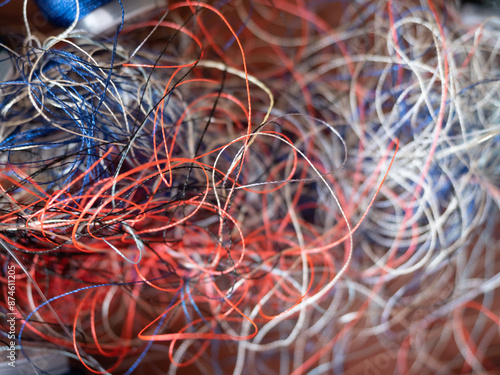 Chaotically tangled threads. Embroidery threads randomly woven. Huge knot. Extreme macro. Beautiful story for intro. Title credits. Abstract screensaver. Handicraft concept, entropy, disorder measure