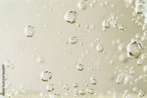 Wallpaper Mural Close-up of beige transparent bubbles in oil or collagen serum, showing cosmetic product molecules on a neutral background.	 Torontodigital.ca