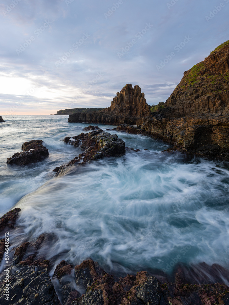 Beautiful rocky coastline with flowing water in the morning. Beautiful rocky coastline with flowing water in the morning.