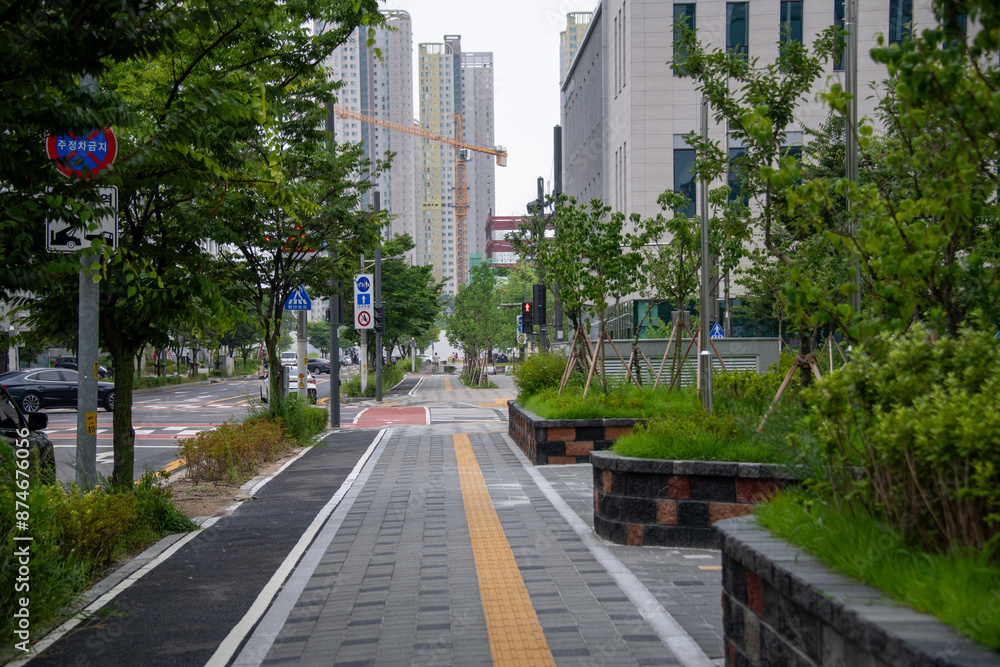 Landscape made of downtown buildings, trees, and grass
Landscape made of downtown buildings, trees, and grass