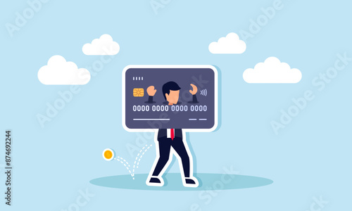 Credit card debt and overspending lead to financial failure and excessive costs, concept of A broke, hopeless office worker, shackled by a large credit card, has empty pockets