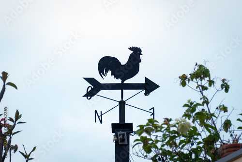 wind vane on a roof photo