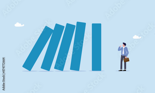 Courage businessman thinking look at collapsing domino effect, risk management, uncertainty or unknown threat causing business failure, economic crisis, danger or problem, security and safety concept.