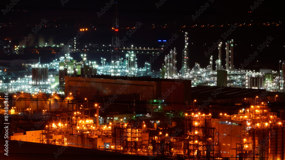 Fototapeta premium A night view of an industrial complex where the lights are not turned off 24 hours a day.