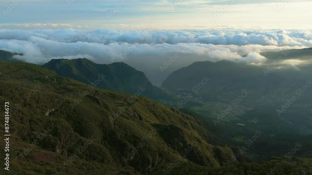 Drone flight above Madeira green mountains during amazing beautiful sunrise. Foggy morning with drifting mist and clouds. Drone point of view, 4K Drone flight above Madeira green mountains during amazing beautiful sunrise. Foggy morning with drifting mist and clouds. Drone point of view, 4K