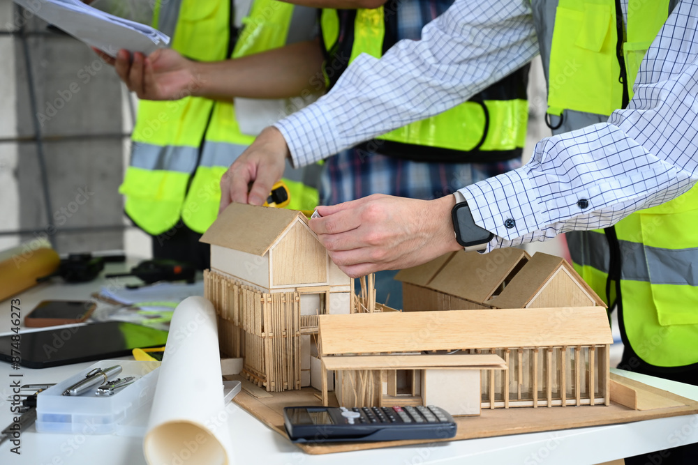 Architect and engineer team discussing about about design building at construction site Architect and engineer team discussing about about design building at construction site