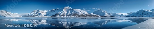 Beautiful Winter Landscape with Snow-Covered Mountains and Frozen Lake Under Clear Blue Sky, Capturing the Essence of Seasonal Change, Holiday Getaways, and Natural Beauty for Stress Relief and Relaxa © Da