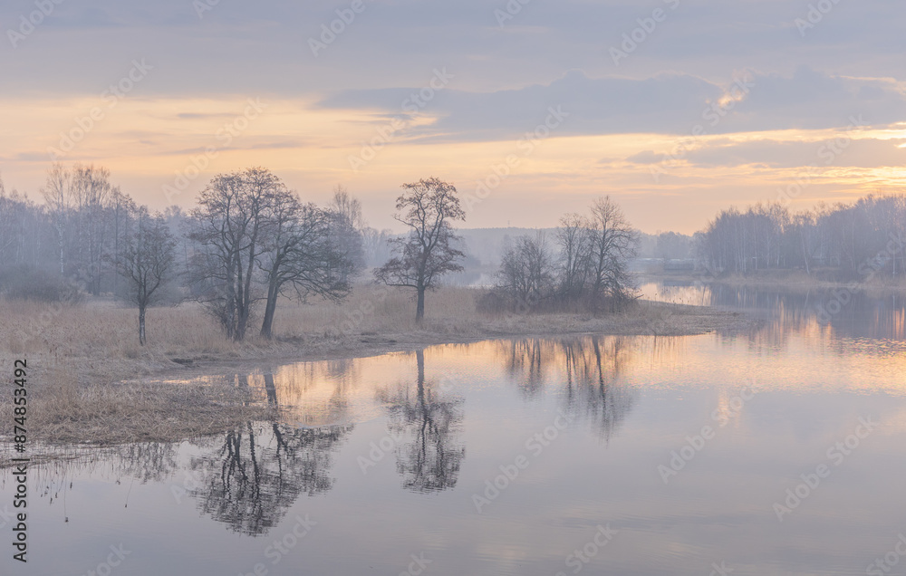 A beautiful spring sunrise at the river. Natural outdoors scenery in Riga, Latvia, Northern Europe. A beautiful spring sunrise at the river. Natural outdoors scenery in Riga, Latvia, Northern Europe.