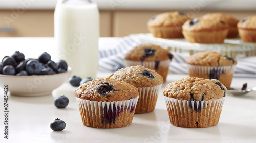 tasty fresh baked blueberry muffins on the table in the kitchen photo