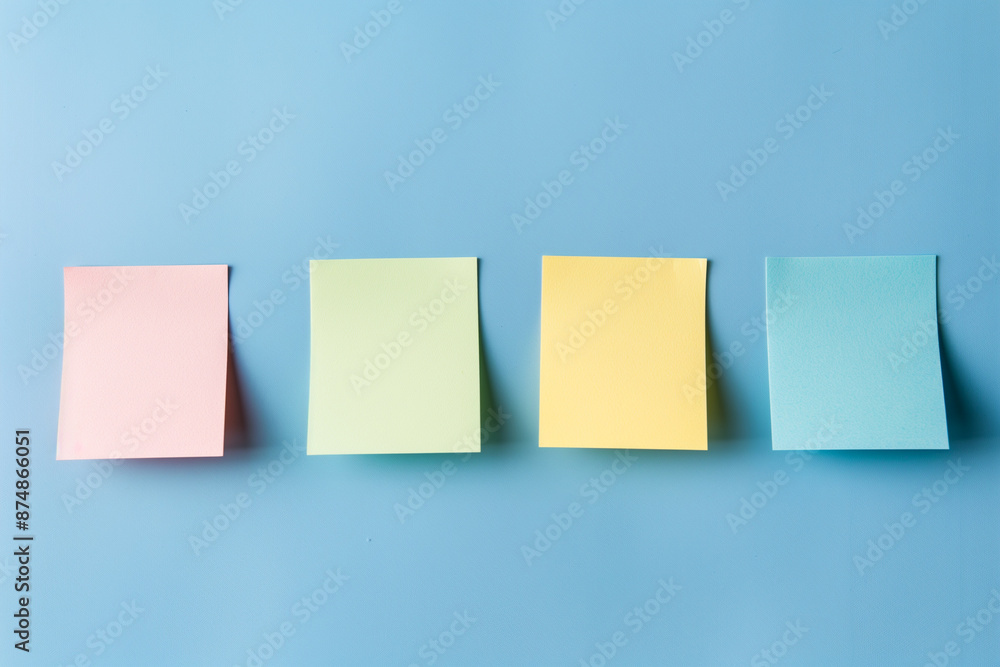 Four empty sticky notes on blue pastel background. Generative AI Four empty sticky notes on blue pastel background. Generative AI