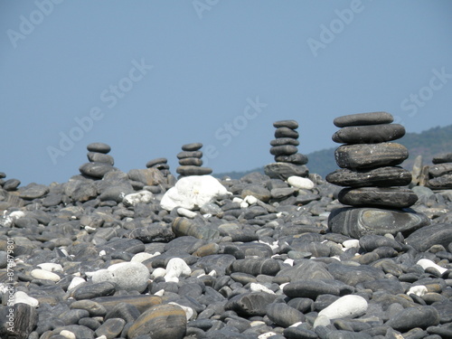 Stacking rocks by the sea. photo