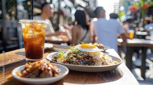 Outdoor dining scene featuring iced coffee and meal