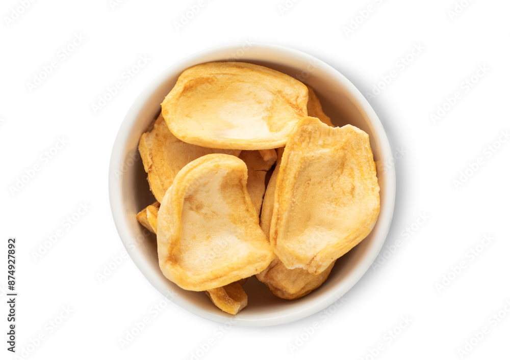 Ceramic bowl with dried breadfruit pieces isolated on white background.Top view. Ceramic bowl with dried breadfruit pieces isolated on white background.Top view.