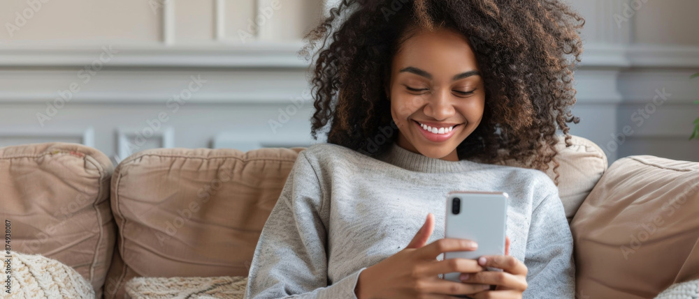 Joyful woman on sofa using smartphone, living digital nomad lifestyle. Joyful woman on sofa using smartphone, living digital nomad lifestyle.