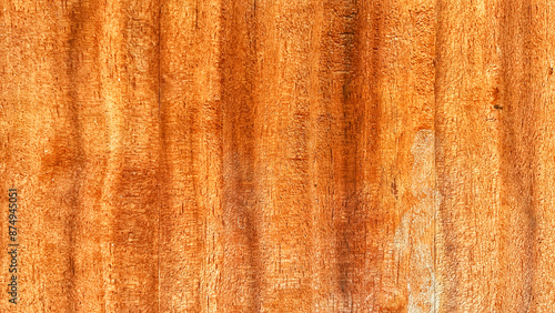 This image shows a grungy brown wood texture background with an old and vintage look The wooden surface has a rough and dark appearance, making it perfect as a backdrop or wallpaper