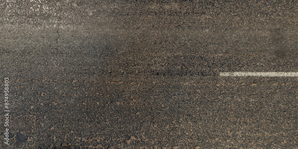 Fototapeta premium view from above on texture of asphalt road with cracks