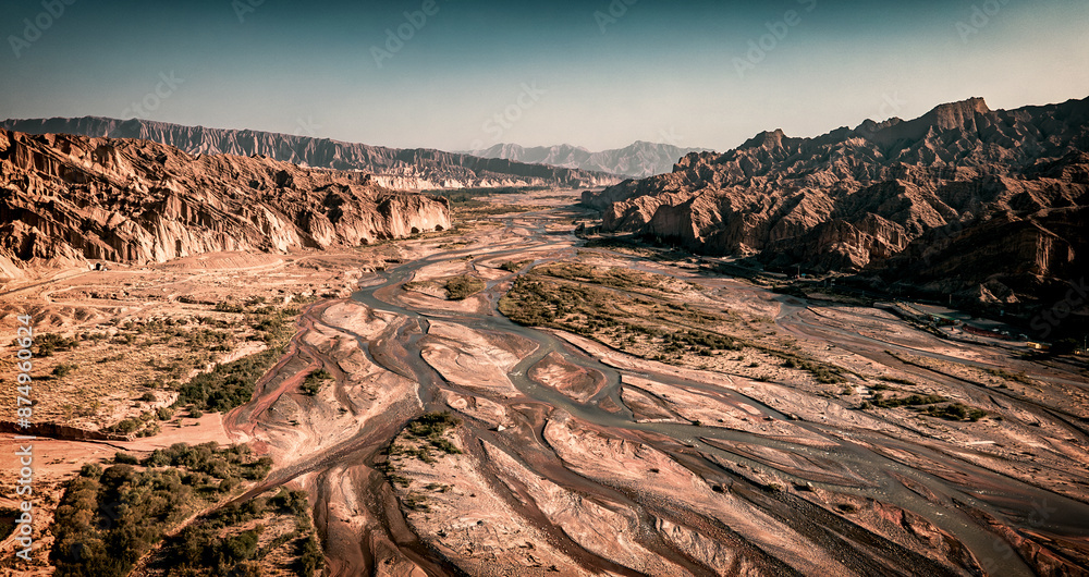 Fototapeta premium Aerial view of rivers and streams extending in desert area near Kizilya Scenic Spot in South Xinjiang, China