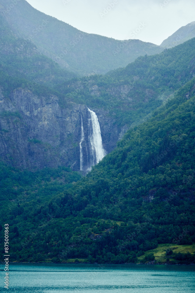 Feigumfossen Waterfall by the Lustrafjorden Fjord a rainy day in July. Feigumfossen Waterfall by the Lustrafjorden Fjord a rainy day in July.